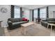 Stylish living room with ample seating and natural light, designed for comfortable living at 1450 E Montague Ave, North Charleston, SC 29405