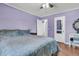 Cozy bedroom with a large bed, hardwood floors, and a door leading to an adjacent room at 1450 E Montague Ave, North Charleston, SC 29405
