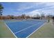 Well-maintained blue and green tennis courts offer a great recreational amenity for residents at 1450 E Montague Ave, North Charleston, SC 29405