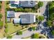 Aerial view of a house with a detached garage and a backyard oasis with a small pool and cozy fire pit at 1526 Old Rivers Gate Rd, Mount Pleasant, SC 29466
