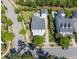 Aerial view of a home, detached garage, and pool, all nestled within a lush, green neighborhood at 1526 Old Rivers Gate Rd, Mount Pleasant, SC 29466