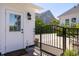 Backyard featuring a metal gate, white picket fence, and well-maintained landscaping at 1526 Old Rivers Gate Rd, Mount Pleasant, SC 29466