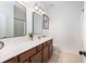 Bathroom with double mirrors, shiplap, and spacious vanity with storage at 1526 Old Rivers Gate Rd, Mount Pleasant, SC 29466