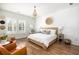 Bright bedroom with shiplap walls, hardwood floors, neutral furniture, and lots of natural light at 1526 Old Rivers Gate Rd, Mount Pleasant, SC 29466