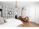 Bright bedroom featuring a chandelier, unique wallpaper, and hardwood floors at 1526 Old Rivers Gate Rd, Mount Pleasant, SC 29466