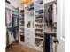 Walk-in closet with custom shelving and hardwood floors at 1526 Old Rivers Gate Rd, Mount Pleasant, SC 29466