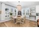 Bright dining area with modern lighting and lots of windows, perfect for Gathering meals at 1526 Old Rivers Gate Rd, Mount Pleasant, SC 29466