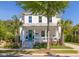 Beautiful two-story home featuring a covered front porch, well-kept lawn, and colorful flower beds at 1526 Old Rivers Gate Rd, Mount Pleasant, SC 29466
