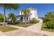 Attractive two-story home with a cozy porch and a long driveway leading to a detached garage at 1526 Old Rivers Gate Rd, Mount Pleasant, SC 29466