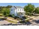 Charming two-story home with a welcoming front porch and lush landscaping, showcasing curb appeal at 1526 Old Rivers Gate Rd, Mount Pleasant, SC 29466