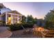 Backyard fire pit with seating area and cozy screened in porch at 1526 Old Rivers Gate Rd, Mount Pleasant, SC 29466