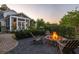 Outdoor fire pit with seating area near a screened in porch at 1526 Old Rivers Gate Rd, Mount Pleasant, SC 29466