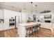 Modern kitchen with white cabinets, stainless steel appliances, and a spacious island with seating at 1526 Old Rivers Gate Rd, Mount Pleasant, SC 29466