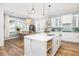 Bright, well-appointed kitchen and dining area with an island, modern fixtures, and hardwood floors at 1526 Old Rivers Gate Rd, Mount Pleasant, SC 29466
