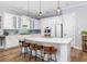 Elegant kitchen with white cabinetry, pendant lights, and a large island perfect for cooking and entertaining at 1526 Old Rivers Gate Rd, Mount Pleasant, SC 29466