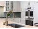 Well-appointed kitchen boasting granite counters, stainless appliances, and white cabinetry with bronze hardware at 1526 Old Rivers Gate Rd, Mount Pleasant, SC 29466