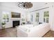 Cozy living room featuring a fireplace, neutral decor, shiplap walls, and lots of natural light at 1526 Old Rivers Gate Rd, Mount Pleasant, SC 29466