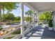 Inviting front porch with elegant columns, decorative railings, and patterned rug providing a welcoming curb appeal at 1526 Old Rivers Gate Rd, Mount Pleasant, SC 29466
