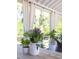 Well decorated porch showing flowers and seating arrangement at 1526 Old Rivers Gate Rd, Mount Pleasant, SC 29466