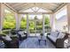 Relaxing sunroom featuring wicker furniture, neutral colors, and natural light at 1526 Old Rivers Gate Rd, Mount Pleasant, SC 29466