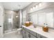 Bathroom featuring a walk-in shower, neutral gray tiling and a granite countertop vanity at 1562 Charming Nancy Rd, Charleston, SC 29412