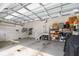 Spacious garage with ample storage, a staircase, and an automatic door opener at 1562 Charming Nancy Rd, Charleston, SC 29412