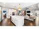Spacious kitchen with an island, stainless steel appliances, and open layout connecting to the cozy living room at 1562 Charming Nancy Rd, Charleston, SC 29412