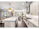 Bright, modern kitchen features white cabinets, a large island, and stainless steel appliances at 1562 Charming Nancy Rd, Charleston, SC 29412