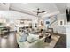 Inviting living room with an open layout, stylish furniture, fireplace, and connection to the modern kitchen at 1562 Charming Nancy Rd, Charleston, SC 29412
