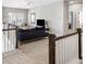 Upstairs living room featuring plush carpet, comfortable seating, and a large screen television at 1562 Charming Nancy Rd, Charleston, SC 29412