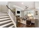 Inviting living room with dark wood floors, neutral furniture, fireplace, and plenty of natural light at 1562 Charming Nancy Rd, Charleston, SC 29412