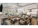 Open concept living and dining area with modern decor, comfortable seating, and bright, airy atmosphere at 1562 Charming Nancy Rd, Charleston, SC 29412