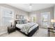 Bright main bedroom featuring a king bed, bedside tables, and natural light at 1562 Charming Nancy Rd, Charleston, SC 29412