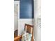 Cozy corner features a wood rocking chair with a patterned pillow and bright natural light from a window at 1562 Charming Nancy Rd, Charleston, SC 29412