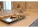 Bright bathroom features a white countertop with chrome faucet and elegant decor at 1651 Indy Dr, North Charleston, SC 29405