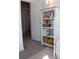 Bedroom view features a bookshelf with books and toys, a crib, and neutral flooring at 1651 Indy Dr, North Charleston, SC 29405