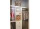 Organized closet with built-in shelving holding folded items, toys, and hanging clothes at 1651 Indy Dr, North Charleston, SC 29405