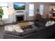 Comfortable living area with large sectional sofa, fireplace, and mounted TV at 1651 Indy Dr, North Charleston, SC 29405