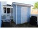 Backyard shed featuring a white door, blue paint and white trim at 1651 Indy Dr, North Charleston, SC 29405