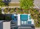 Aerial view of an amazing backyard featuring a pool, tanning deck, fire pit, landscaping, and outdoor seating areas at 1659 Pierce St, Daniel Island, SC 29492