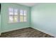 Bright bedroom featuring wood flooring and plantation shutters on the windows at 1659 Pierce St, Daniel Island, SC 29492
