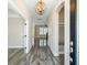 Inviting foyer with beautiful tile flooring, chandelier lighting, and a convenient built-in nook for storage and organization at 1659 Pierce St, Daniel Island, SC 29492
