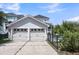 Two car garage with access to the pool and backyard entertaining area at 1659 Pierce St, Daniel Island, SC 29492