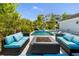 Gorgeous outdoor pool area with in-pool furniture, a fire pit surrounded by lounge seating, and privacy landscaping at 1659 Pierce St, Daniel Island, SC 29492