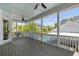Outdoor living space features a screened porch, ceiling fans, and views of the community pool at 1659 Pierce St, Daniel Island, SC 29492