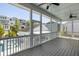 Outdoor living space features a screened porch, ceiling fans, and views of the community pool at 1659 Pierce St, Daniel Island, SC 29492