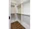 Spacious walk-in closet with custom shelving and wood flooring, perfect for organization at 1659 Pierce St, Daniel Island, SC 29492