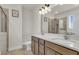 Bathroom showcasing a double vanity, an oversized mirror, and a glass shower with neutral tile at 171 Sara St, Saint George, SC 29477
