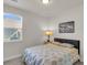 Comfortable bedroom with a window, patterned bedding, and a nightstand with lamp at 171 Sara St, Saint George, SC 29477