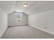 Large bonus room featuring neutral carpet, a window for natural light and fresh paint at 171 Sara St, Saint George, SC 29477